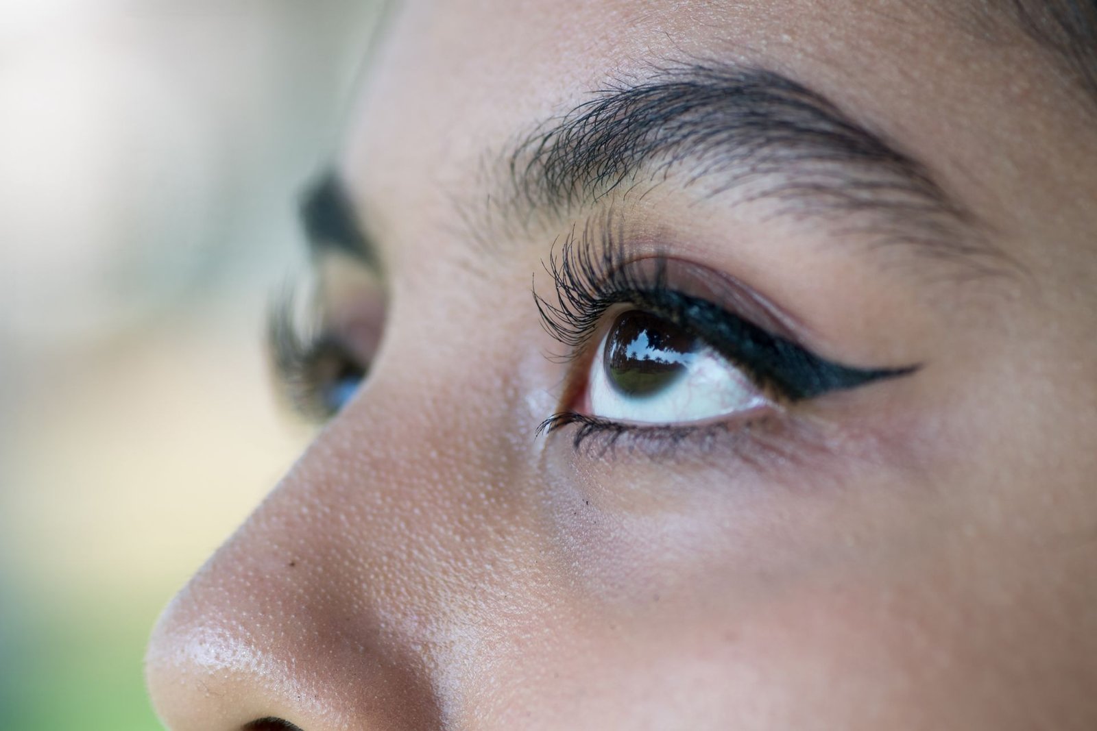 Beautiful Asian eyes sporting luscious brows.